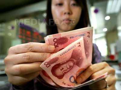 Economia Chinei a crescut în trimestrul patru al anului trecut cu 7,7%, încetinind ușor